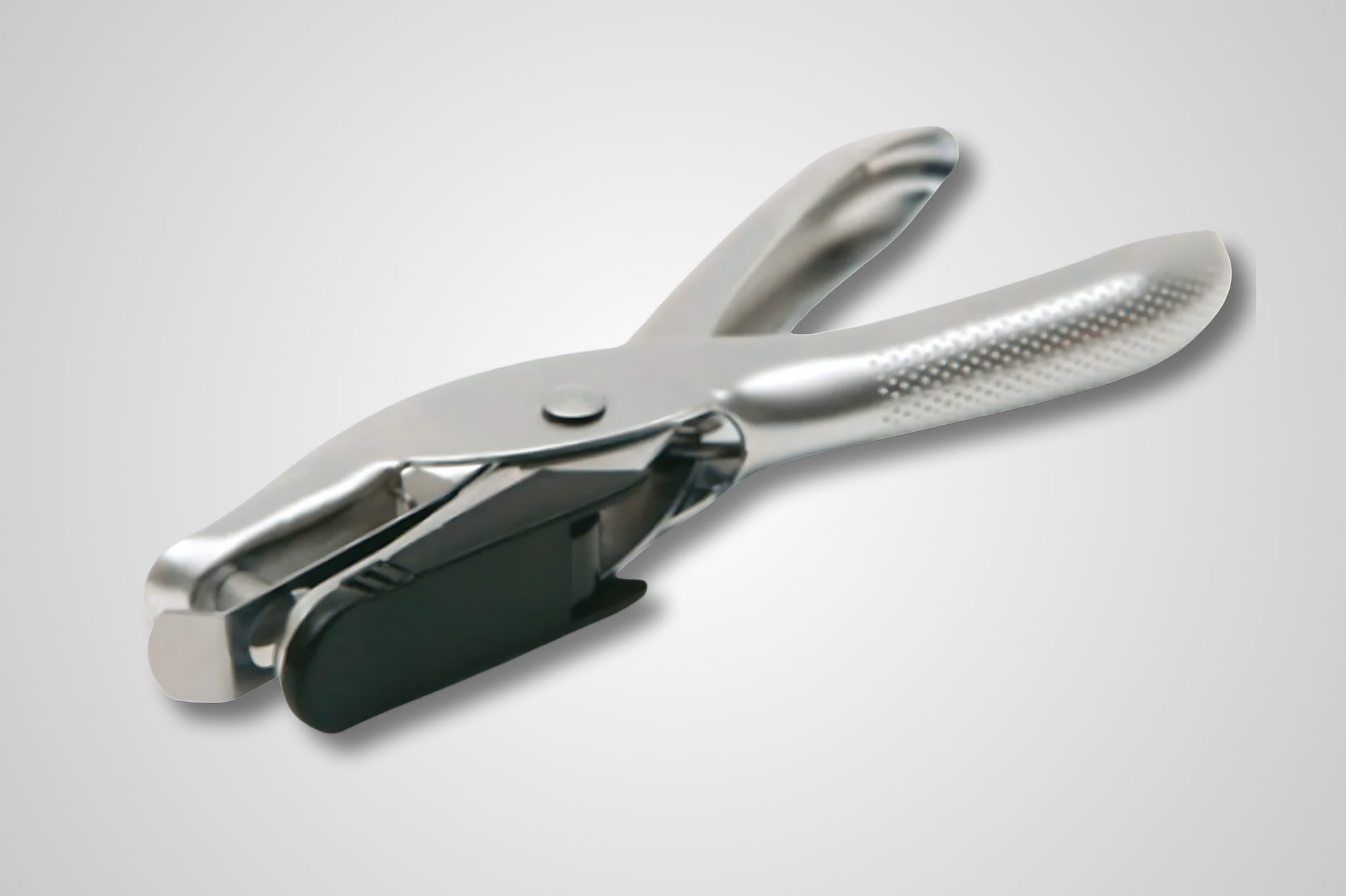 Et foto av Papir hull maskine fra JM Band®. Kjøp Tilbehør i adgangsprodukter her.