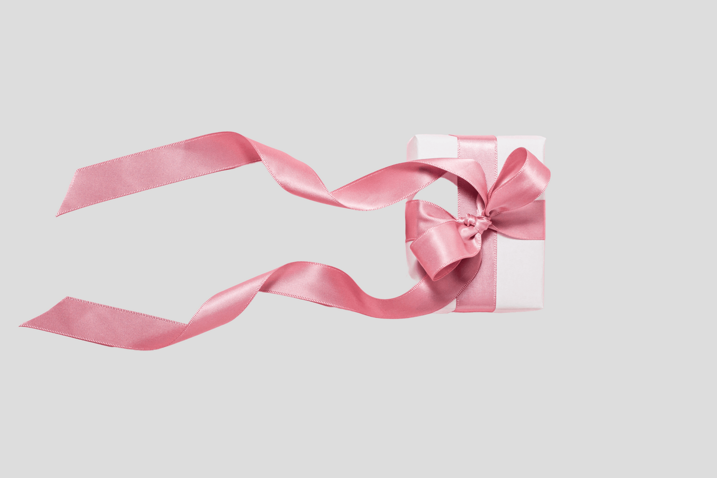 Et rosa Gavebånd stof med tryk Design selv med rosa sløyfe og innvielse på hvit bakgrunn, fra JM Band®.