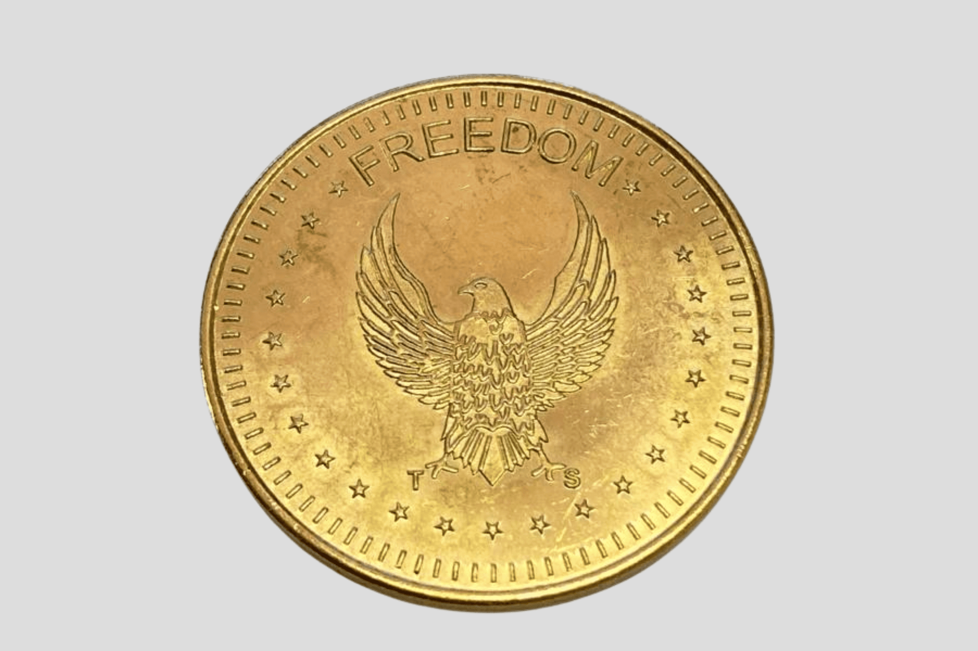 En gullmynt med en ørn på, laget av JM Band® Poletter metall preget På lager.