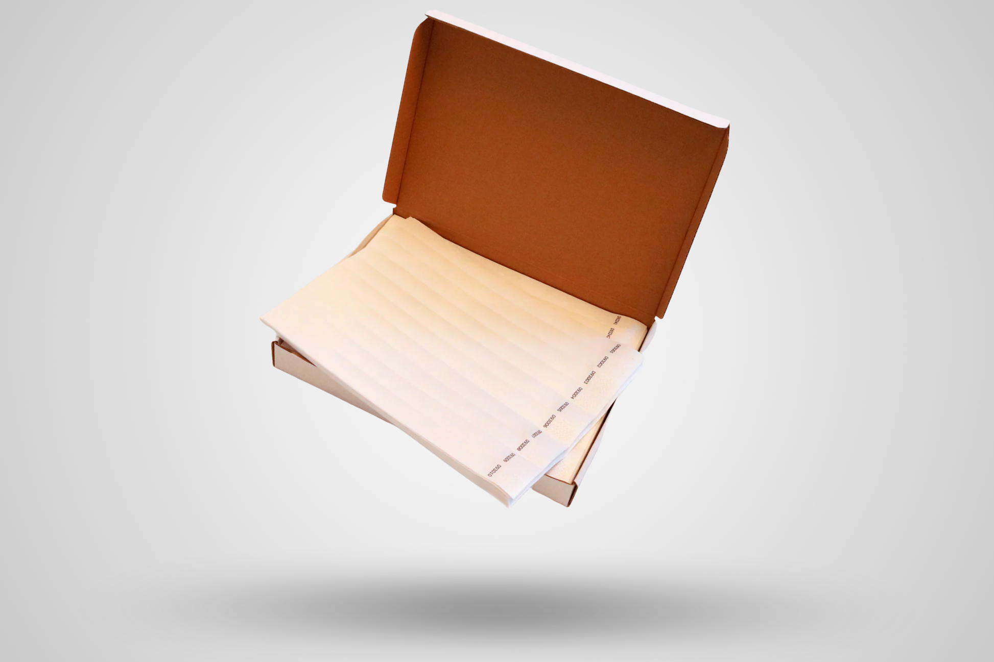 Et foto av Kasse med 1000 papirarmbånd fra JM Band®. Kjøp Papirarmbånd i Hvit her.