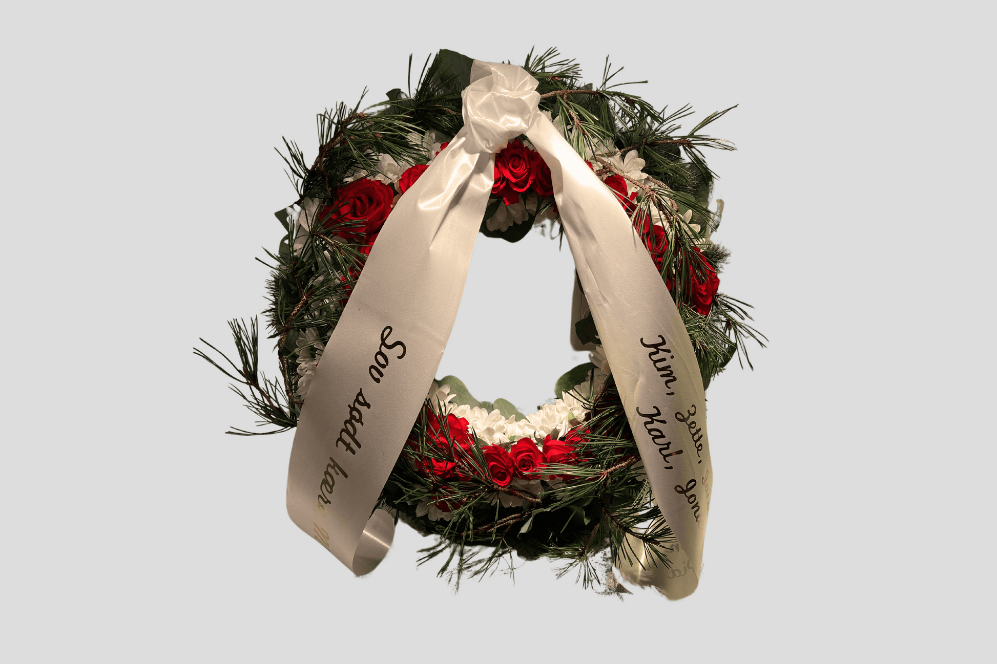 En krans med Bukettbånd ECO satengtrykk Design selv bånd fra JM Band® på.